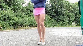 Crossdresser outdoors in Tan pantyhose and pink mini skirt.1