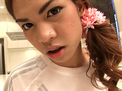 Asian ladyboy teen Kitty in a football uniform anal stuffed
