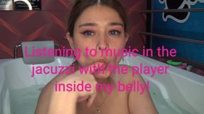 Listening to music in the jacuzzi, with the player inside my belly!
