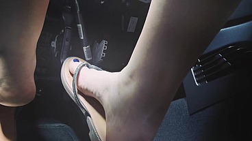 Driving in flip-flops and pedaling blue nail polish