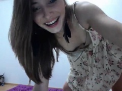 Alluring brunette teen in a sexy dress sensually flashes he