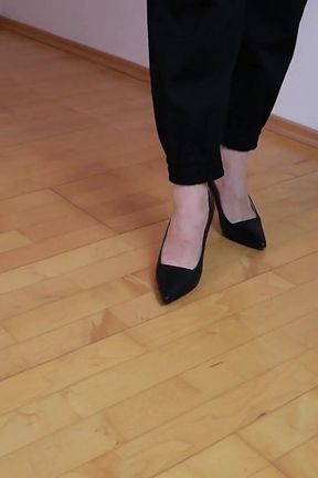 Elegant Shoe Dangling in High Heels and Ultra Sheer 12den Pantyhose
