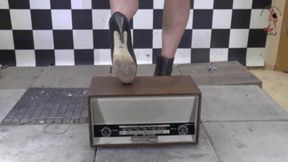 Old historical Radio crushed under high heel Boots
