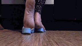 Dirty feet in blue flip flops
