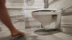 Without shoes and pants in public toilet