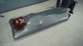 Sonya gagged in a gray vacuum mattress bed