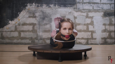Luisa hogtied on the turntable
