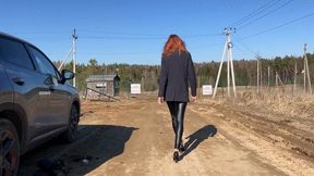 girl in high heels walks slowly and for a long time through the mud, ruining her beautiful leather shoes
