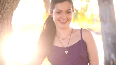 Charming teen April Valentino flashing her tits and pussy outdoors