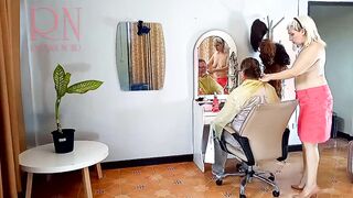 Nudist barbershop. Naked lady hairdresser inside an apron. The client is surprised. one