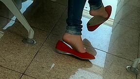 Amateur Beauty Dangles Her Red Flat Shoes In Public
