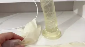 I give a handjob to the dildo with oily hands in medical white gloves