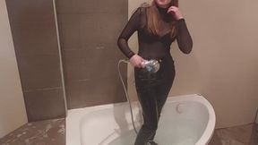 Wetlook in black jeans and black sheer blouse