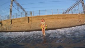 Alla wears an inflatable vest and inflatable armbands and swims in the sea!!!
