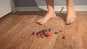 Fifi smooshing blueberries and raspberries in nude pantyhose