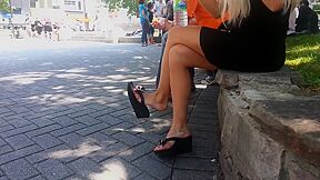Dangling Black Sandals On Sunny Street