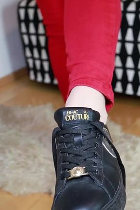 Red Jeans and Black Sneakers