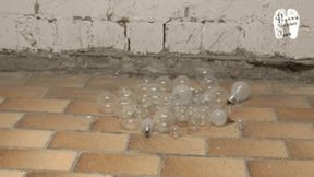 Glass balls and light bulbs under wooden Sandals