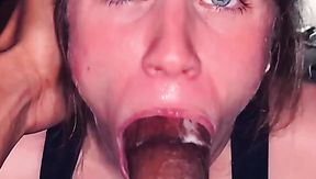 Blue-eyed submissive maintains eye contact while sucking BBC tip