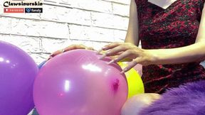 nails popping balloons with garland inside