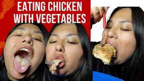 Eating chicken with vegetables