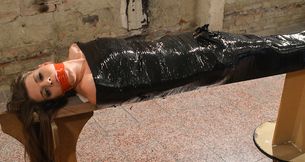 Monalee wrapped in plastic mouth-stuffed tapegagged
