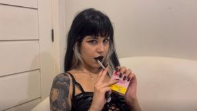 Smoking cigarette with black lipstick