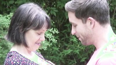 Neighbor fucks a cheating housewife in the yard and she moans loudly