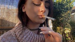 outside smoking with a bee cigarette holder