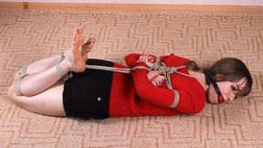 Ballgagged barefoot Agnes in red sweater and black shorts, hogtied with hemp rope, struggles on the floor (HD WMV)