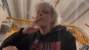 goth girl no makeup smoking a cigarette in silence