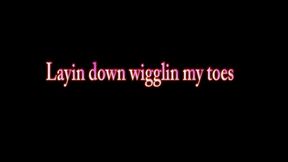 Layin down wigglin my toes