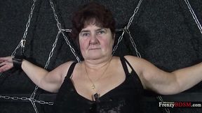 Chained chubby granny Hana gives a blowjob standing on her knees