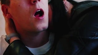 A leather-clad dominatrix seduces me by kissing my neck