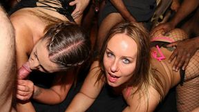 Lusty partners indulge in a group sex session at a swinger club
