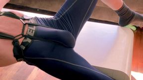 deep writhing on table in 3/4 compression tights with groin and spine brace making tight bulge and ass