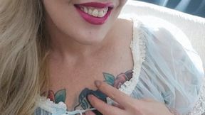 Blonde milf dressed in transparency, with a lot of sensuality smoking her red Marlboro