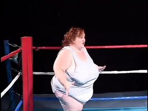 Fat midget girl is shoving a dildo in lesbian midget&#039;s pussy
