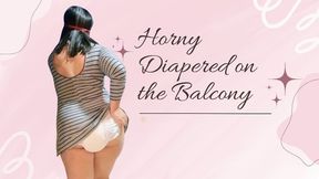 Playing DIAPERED on the balcony