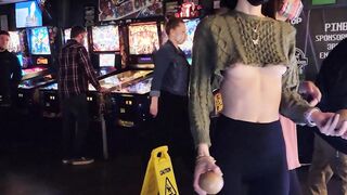 Brazenly flashing melons inside a busy arcade