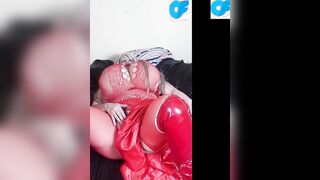 Susi is wearing a red fishnet suit fucking snatch with bbcs dildo