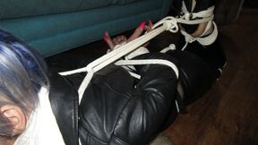 Lauri gets hogtied in tight leather pt 2