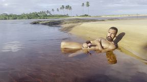 naked and jerking off inside a lagoon