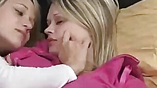 Two busty blonde babes having lesbian sex in bedroom