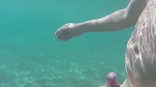 Hand Job underwater into outdoor beach