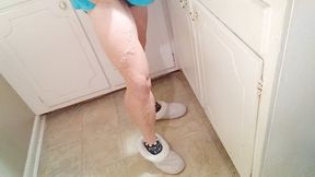 Tempest flexing as she cleans kitchen