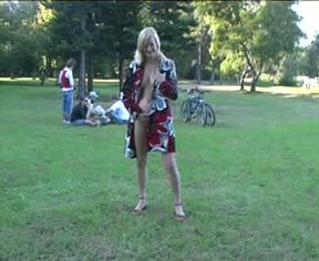 Busty and lean white girl in the park flashes her breasts topless
