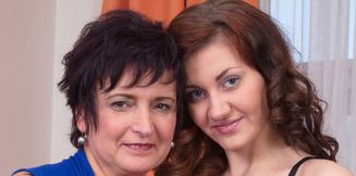Busty mature lady and sexy teen go down on each other