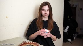 Stella is smoking Eve 120s cigarettes in the kitchen at home using matches (2)