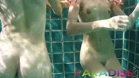 Twins fuck lucky guy underwater in threesome